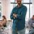 portrait-of-young-smiling-businessman-standing-in-2026-03-20-04-11-21-utc-scaled-1.jpg
